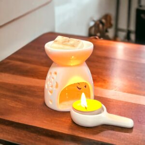 White Ceramic Tea Light Wax Melter with lit tea light